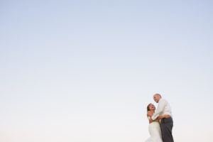 bride and groom at sunset