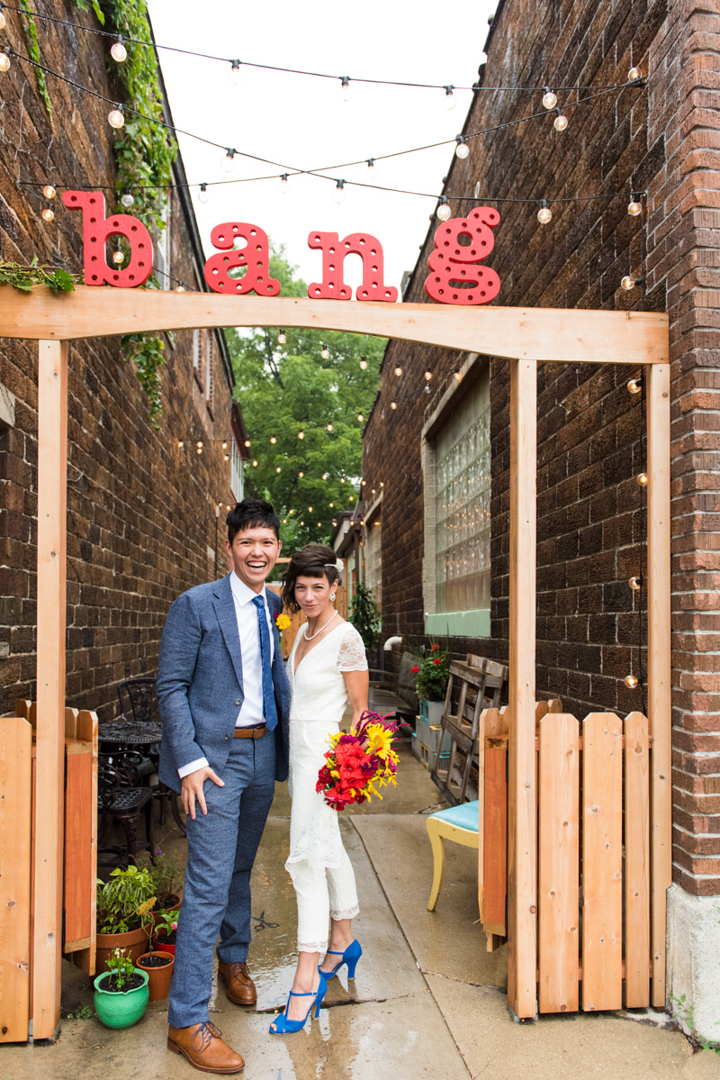 coolest couple in madison and jumpsuit bride