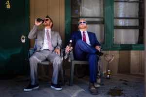 groomsman and groom sitting and drinking beer at Valhalla in Tahoe