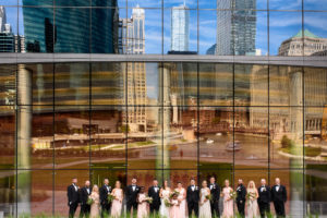 Chicago Wedding Party Posed in front of building on the riverwalk