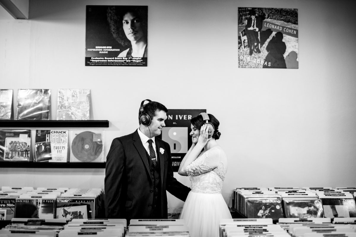bride and groom listen to music on their wedding day at mad city music