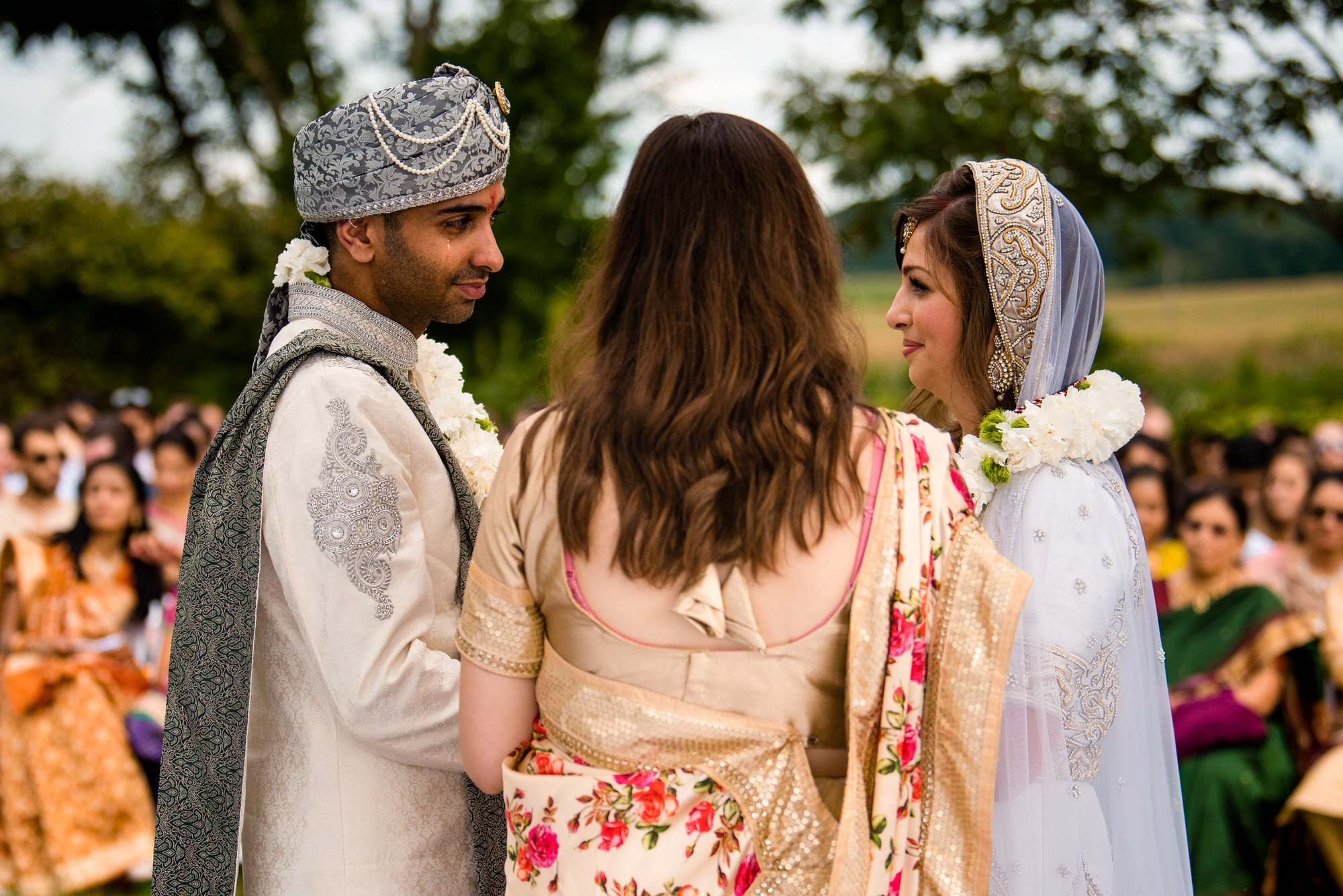 groom cries during outdoor wedding ceremony at Justin trails resort