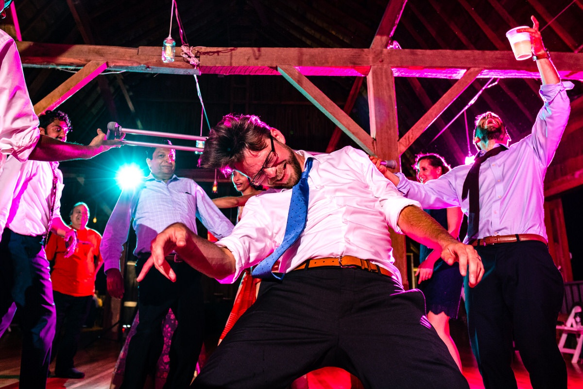 wedding dance limbo with groom's crutch