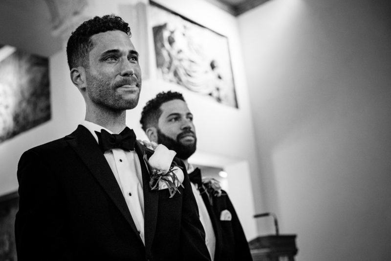 Groom crying as the bride walks down the aisle