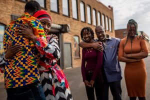 family hugs outside of the goodman center in Madison Wisconsin