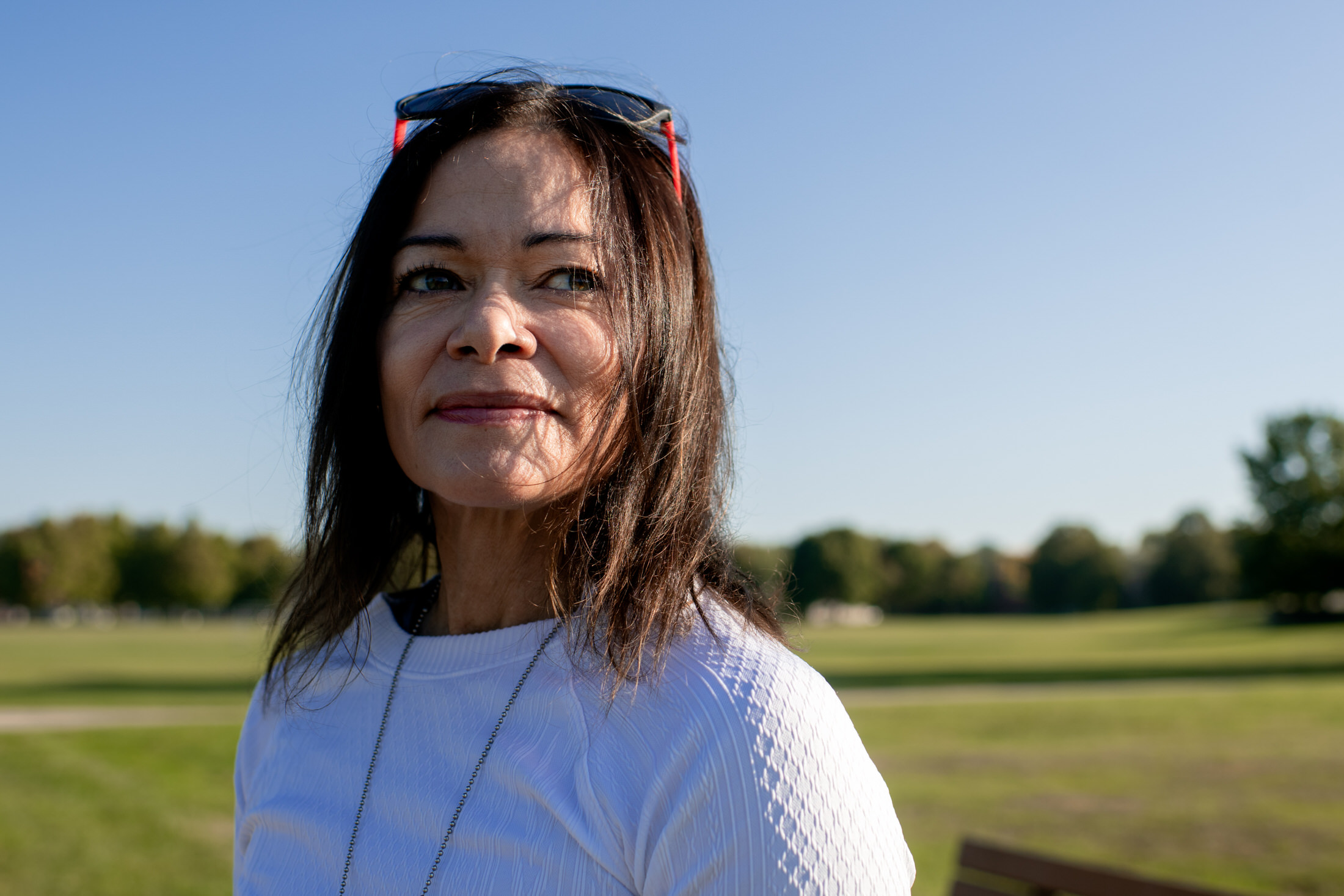 woman poses for a portrait at Warner park in the morning