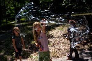 kids pop bubbles at fern fest in Michigan