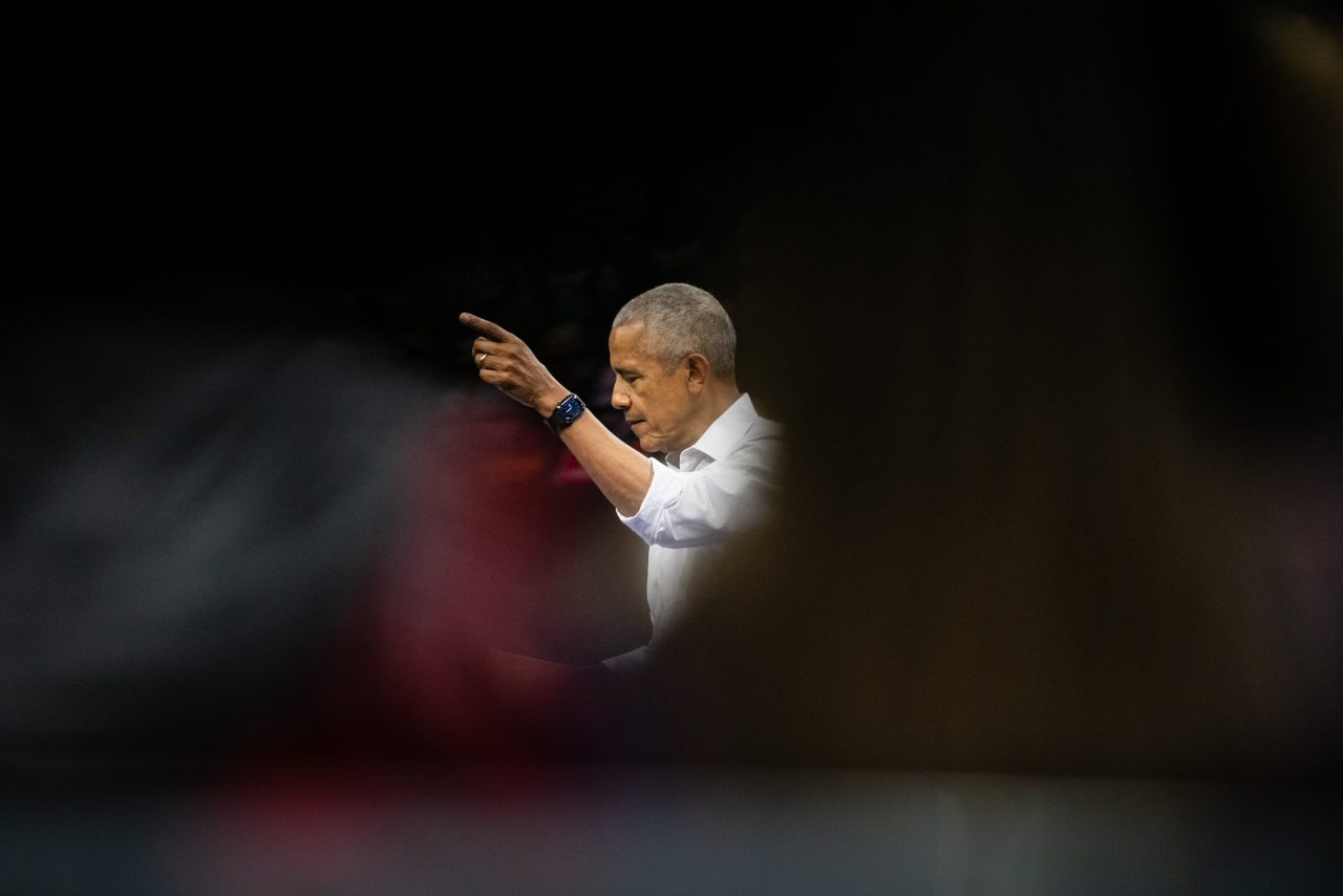 Former President Barack Obama gestures with his finger raised while addressing a crowd, delivering his familiar message, “Don’t boo, vote.”