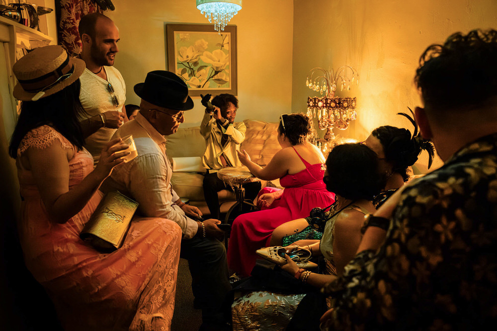 Tattoo artist at wedding puts glove on to get ready to tattoo the bride